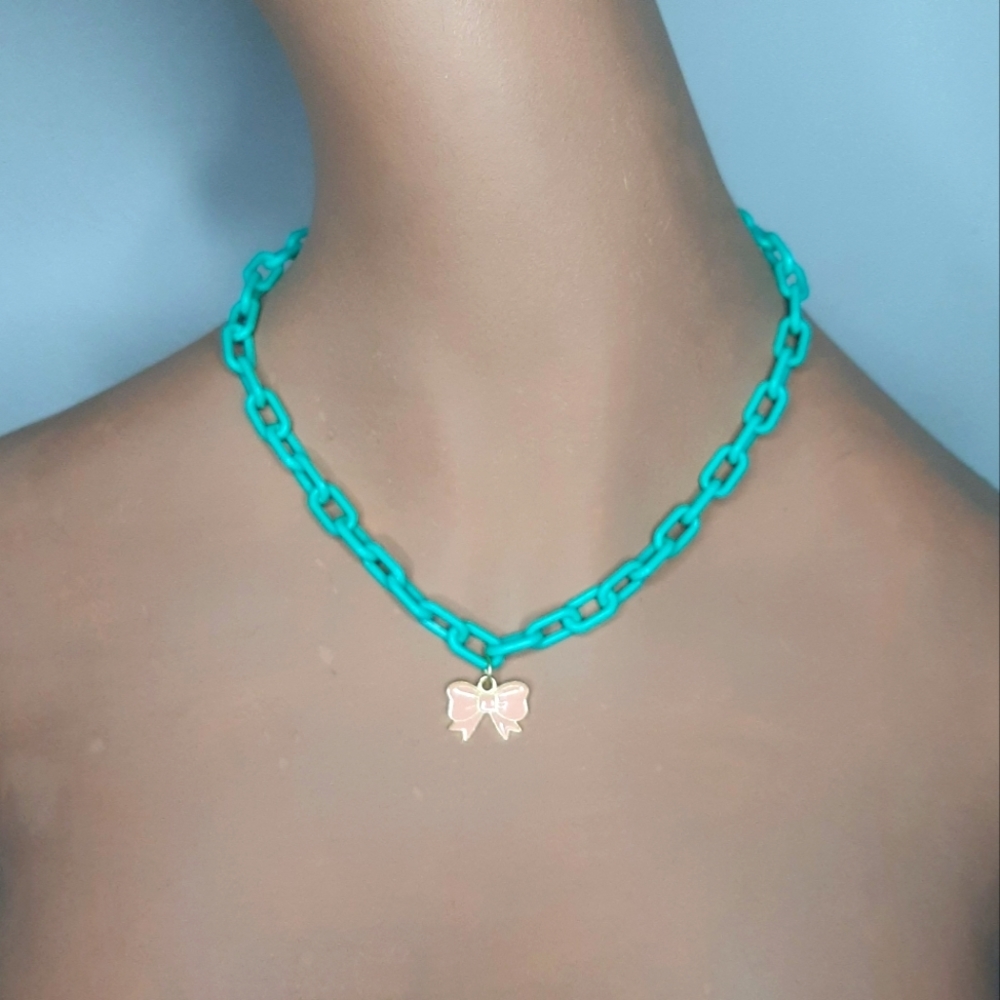 Plastic Aqua Link Necklace with Light Pink Bow Pendant.